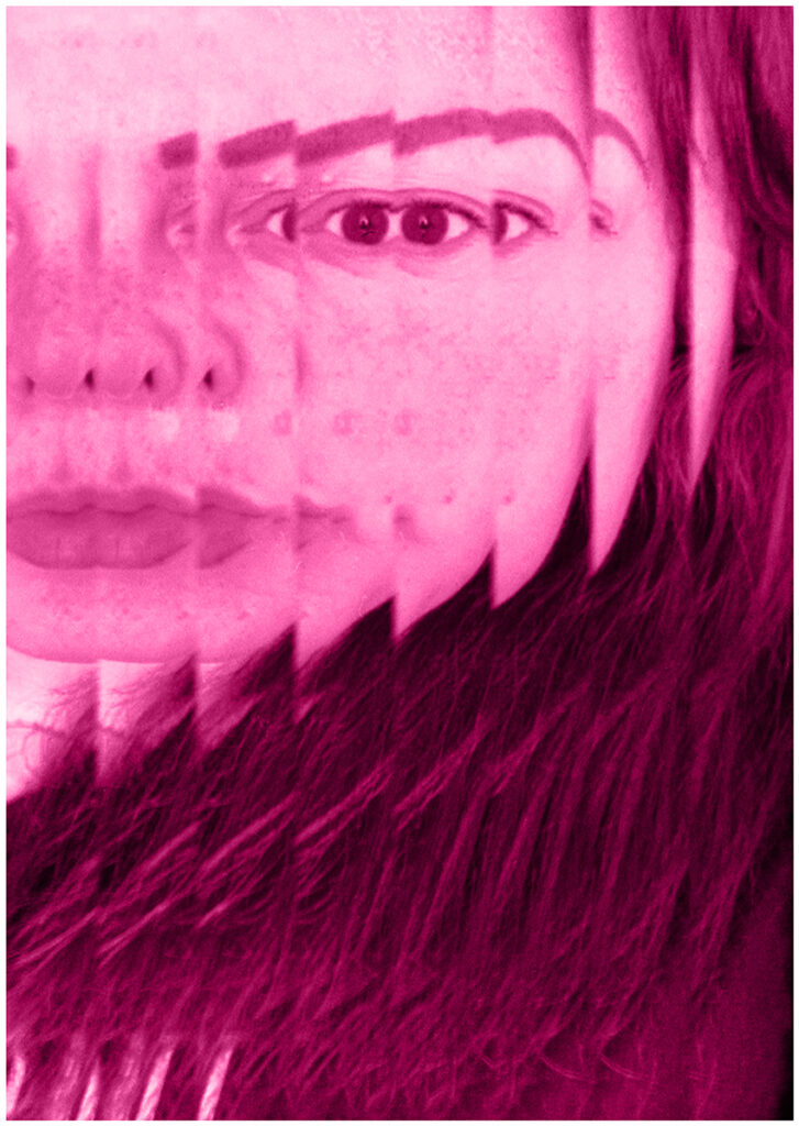 Hot pink tint on A2 portrait sized black and white image of close up of womans face facing the camera. The image has been overlaid multiple times so that the subject’s face is extended across eight strips vertically. Dark hair frames her face.